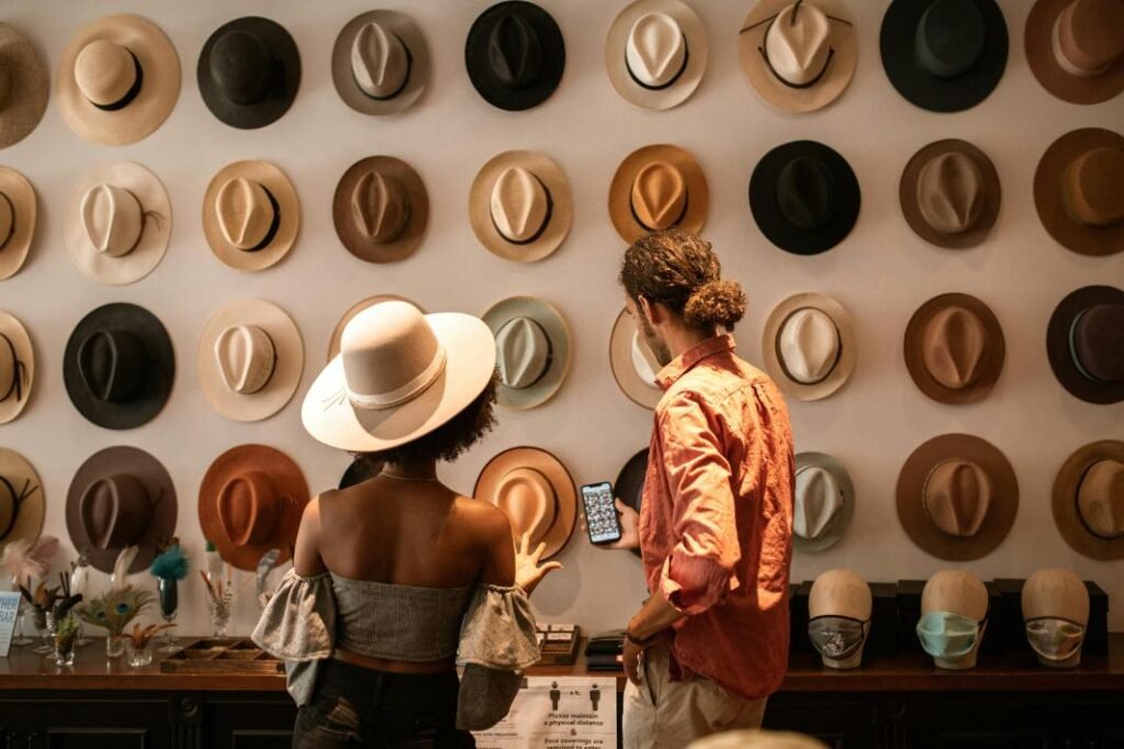 Couple picking hats to buy
